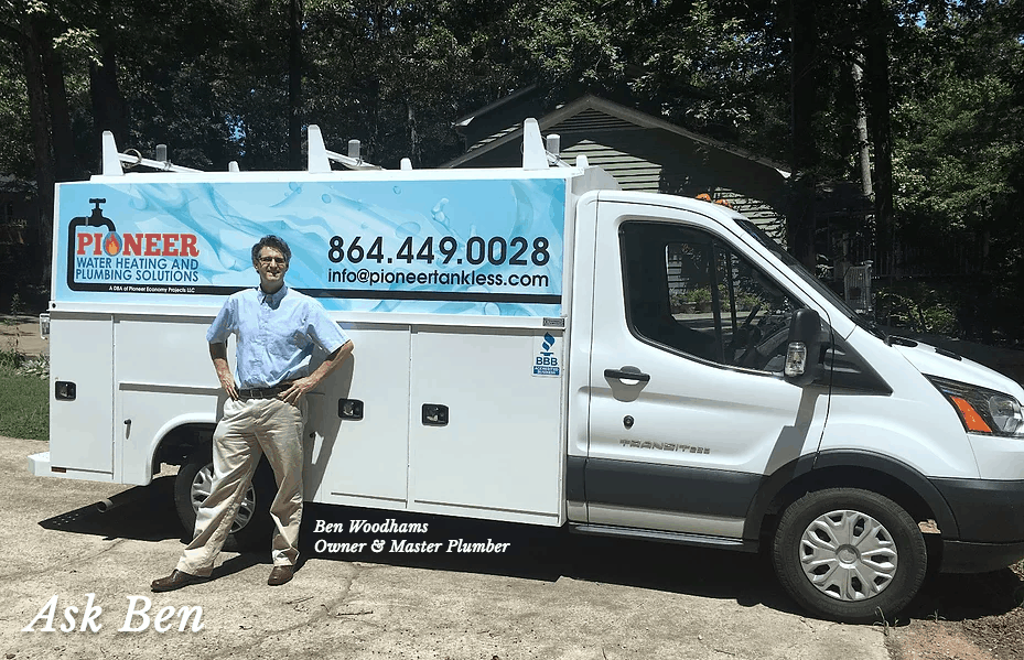 Professional plumber Benjamin Woodhams standing with his plumbing work truck from which he does new plumbing and water heater installations and repairs